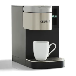 Standalone side shot Keurig coffee brewer Quench 171 with mug and white background