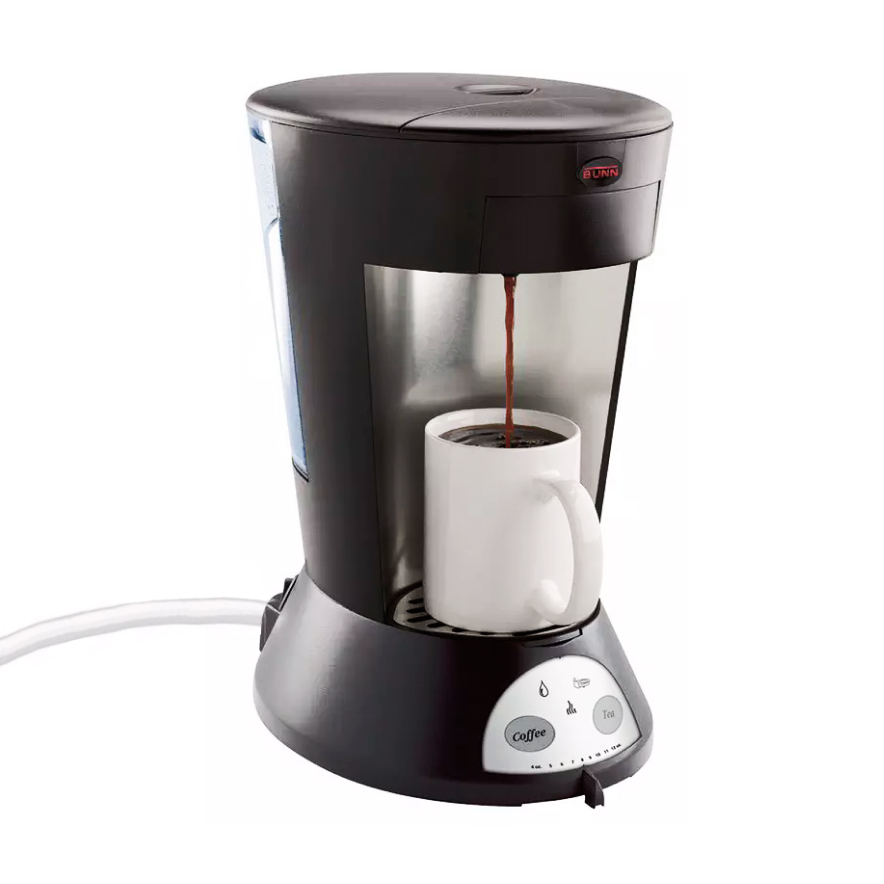 Standalone of Quench 165 pod coffee brewer with mug underneath and white background