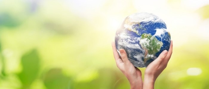 A person holding the Earth in their hands