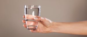 glass of water in hand