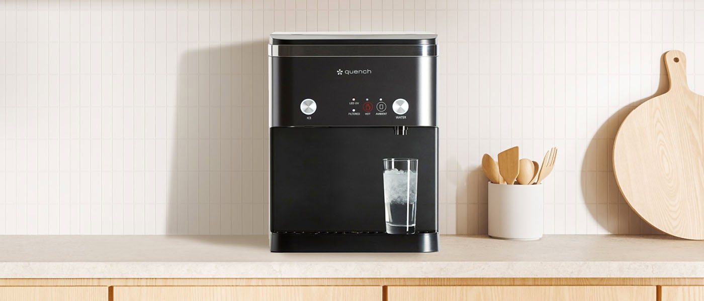 965 countertop ice maker on top of a wooden countertop