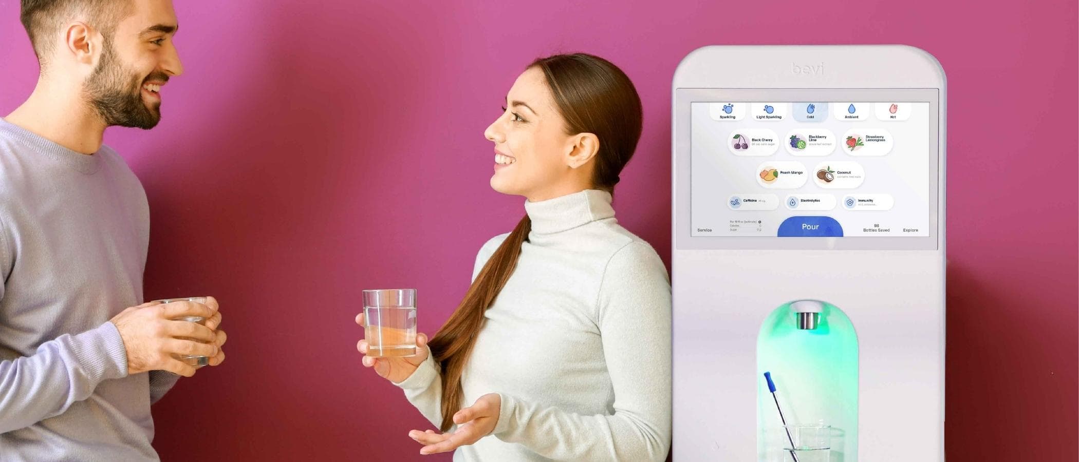 people talking near flavored sparkling water machine
