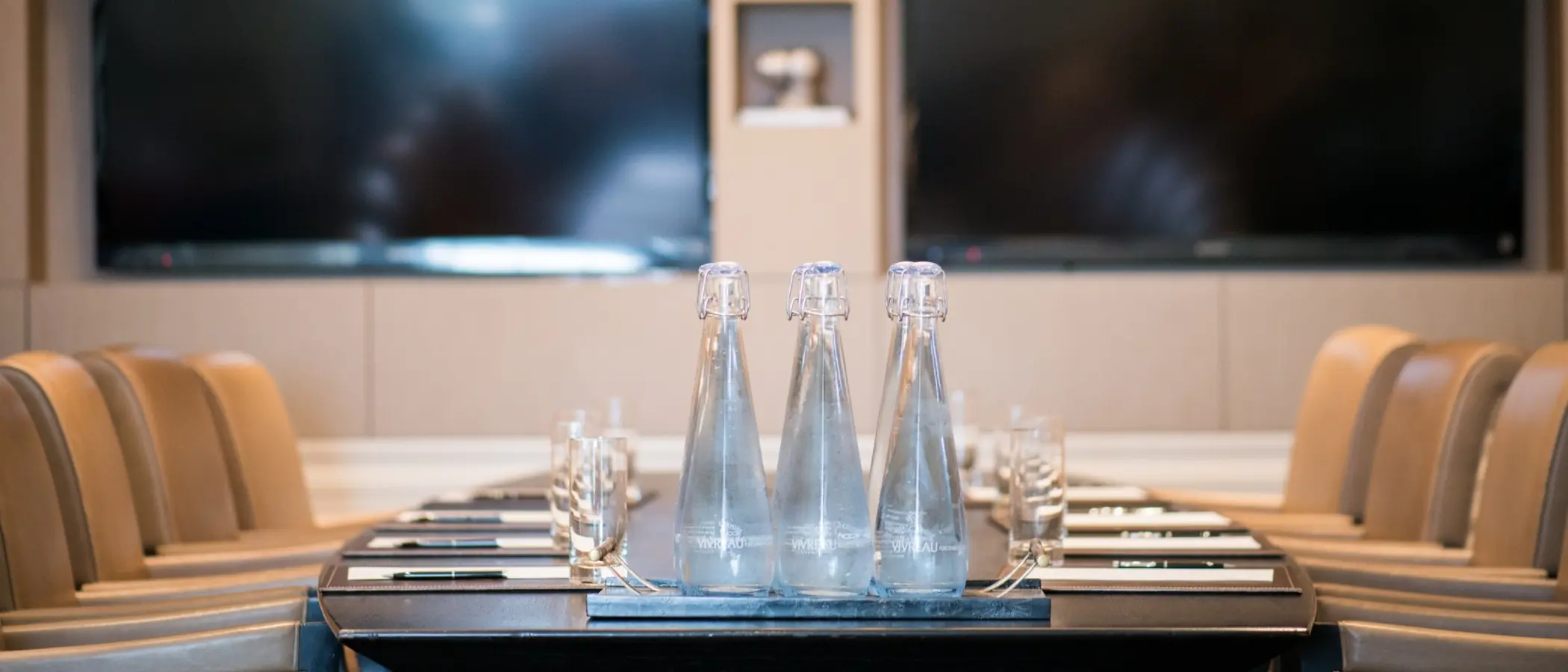 Sparkling water bottles in meeting room