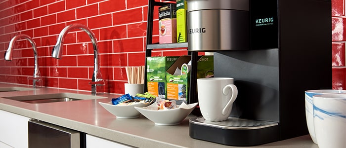 Coffee brewer machine on countertop for blog hero image
