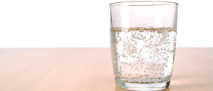 glass of sparkling water on a table