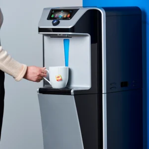 Woman dispensing water into a mug from the Quench Q9 freestanding water dispenser