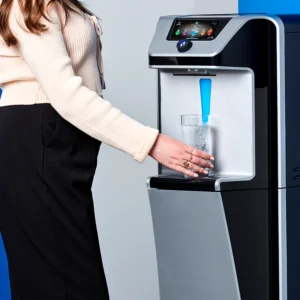 Woman dispensing water from the Quench Q9 freestanding water dispenser