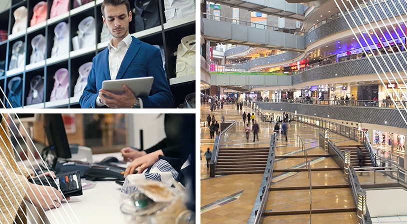 Man in blue suit looking down at tablet; customer standing at cashier with open wallet; wide shot of the inside of a mall